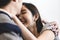 Lovely attractive young Asian couple man kiss forehead of happy woman with and hug in romantic moment. Warm heart marriage and lov