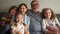 Lovely big happy family. Portrait of grandparents with three grandchildren. A large group of people, five people are