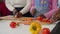 Lovely black teenage sisters helping mother to prepare meal