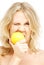 Lovely blond biting lemon