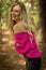 A Lovely Blonde Model Poses Outdoors In A Forrest Environment