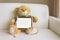 Lovely brown bear gift doll an taplet and tape measure on sofr