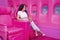 A Lovely Brunette Model Poses For The Camera While Having Fun On A Pink Jumbo Jet