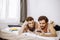 Lovely caucasian gays on bed, use mobile phone