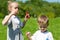 Lovely children blow soap bubbles