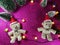 Lovely couple bear and christmas tree on pink gliter background near ornament lighting bulb at silent night, holy night, Merry Chr