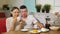 Lovely couple drinks tea having date in confectionery shop