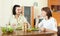 Lovely couple having dinner with vegetables at home