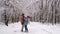 lovely couple having fun in snowed forest