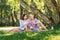 Lovely couple having a pleasant time eating fruits in the park