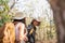 Lovely couple lesbian woman with backpack hiking in nature. Loving LGBT romantic moment in mountains