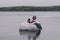 Lovely couple lounging on the floating bed in lake