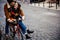 Lovely couple on one bike in the street stock photo