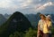 Lovely couple at sunset on top of the Chinese mountain of Moon Hill