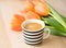 A lovely cup of  blackcoffee with orange tulips concetp for morning coffee from top views