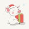 Lovely cute cheerful piggy sits in a red Christmas hat with a gift. Card with cartoon animal.