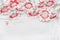 Lovely daisies flowers on white shabby chic background, floral border, top view. Creative layout for holidays greeting