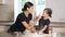 Lovely daughter and mother play with flour and dough