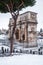 A lovely day of snow in Rome, Italy, 26th February 2018: a beautiful view of the Arch of Costantino near the Colosseum under the