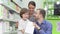 Lovely family examining their pharmacy purchase in a shopping bag