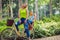 lovely family having quality time outdoors- mother and son riding a bicycle together in park Happy family..