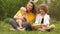 Lovely family hugging in the park at a picnic. Happy Easter family. Mom and two sons. Mothers Day