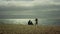 Lovely family making photo at sea beach. Parents child using camera photoshoot