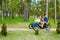 Lovely family riding quadricycle pedal car