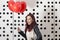 Lovely fashion girl with Valentine heart balloons