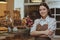 Lovely female baker working at her cafe