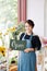 Lovely florist holding open sign