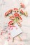 Lovely flowers bouquet with blank white card ,bow and bokeh on shabby chic background