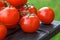 Lovely fresh small red tomatoes on the vine