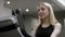 Lovely girl in black sport wear hardly work on exercise bike with focus on hands in the new gym