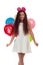 Lovely girl brunette with long hair in a white dress with a bow on her head and balloons posing on a white background