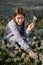 Lovely Girl Making Bunch of Dandelion Flowers on Beautiful Dandelion Field