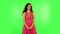 Lovely girl smiles broadly, winks and makes sign ok. Green screen