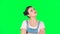 Lovely girl is very offended and looks away on green screen, slow motion