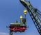 Lovely green steam train hanging in front of a blue sky, Germany