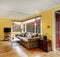 Lovely hardwood living room with colorful sofa, and yellow walls