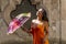 A Lovely Hispanic Brunette Model Poses Outdoors On A Mexican Ranch Holding A Parasol