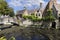 Lovely historic little Boniface Bridge over water channel Dijver Canal, Bruges, Belgium