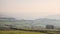 Lovely landscape image of the Peak District in England on a hazy Winter day viewed from the lower slopes of Bamford Edge