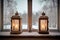 lovely lanterns in window with view of snowy winter landscape