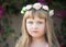 Lovely little baby girl with daisy wreath on her head