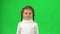 Lovely little female is feeling sick in the studio on green screen.