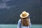 A lovely long hair lady takes pictures of Lake Louise