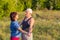 Lovely lovers. Elderly couple on a sunny summer day at sunset