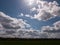 A Lovely Lush Meadow on A Clear Sping Day with Beautiful Clouds