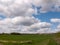 A Lovely Lush Meadow on A Clear Sping Day with Beautiful Clouds